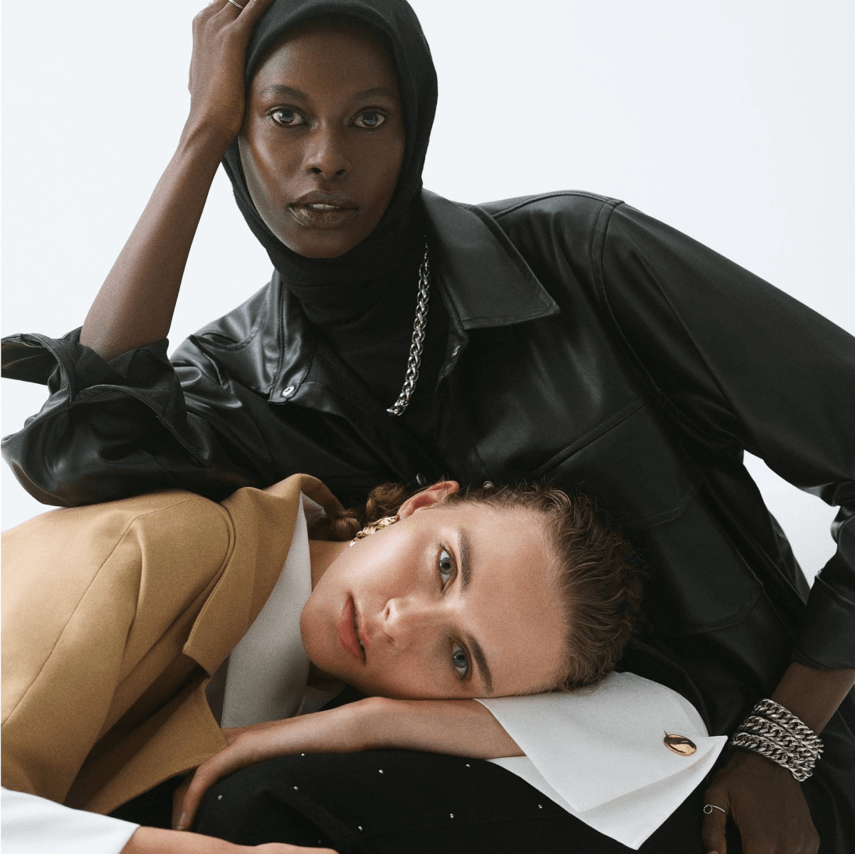 a black lady and a white lady posing